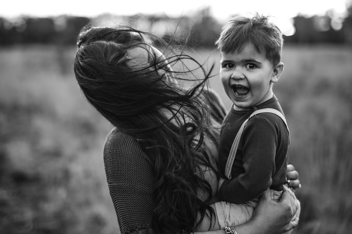 black and white close up chld laughing maternity pregnancy