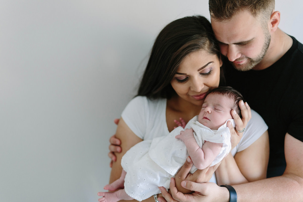 colour family newborn baby daughter family snuggle on the bed lifestyle photography yasmin anne