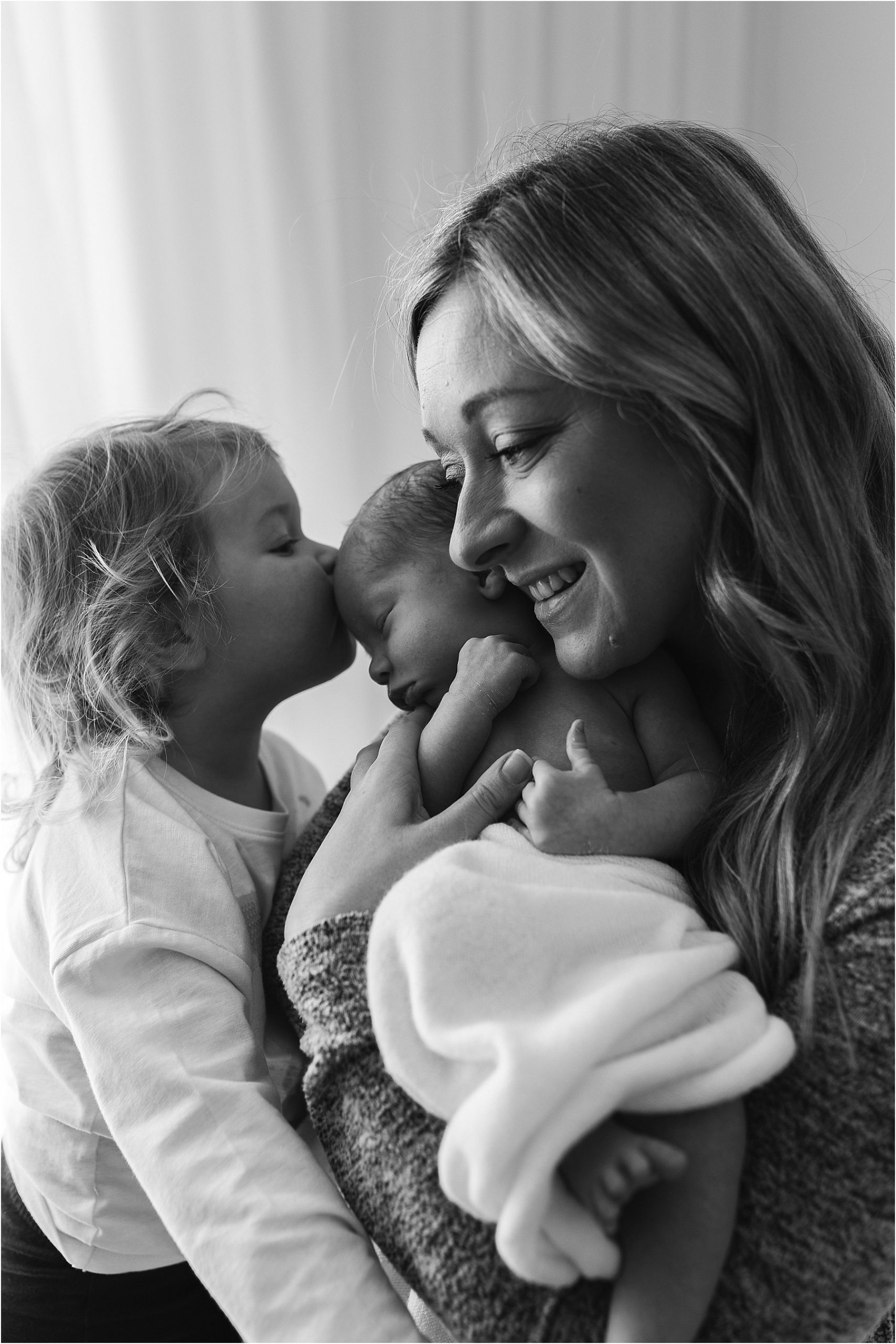 newborn baby with mum in natural studio