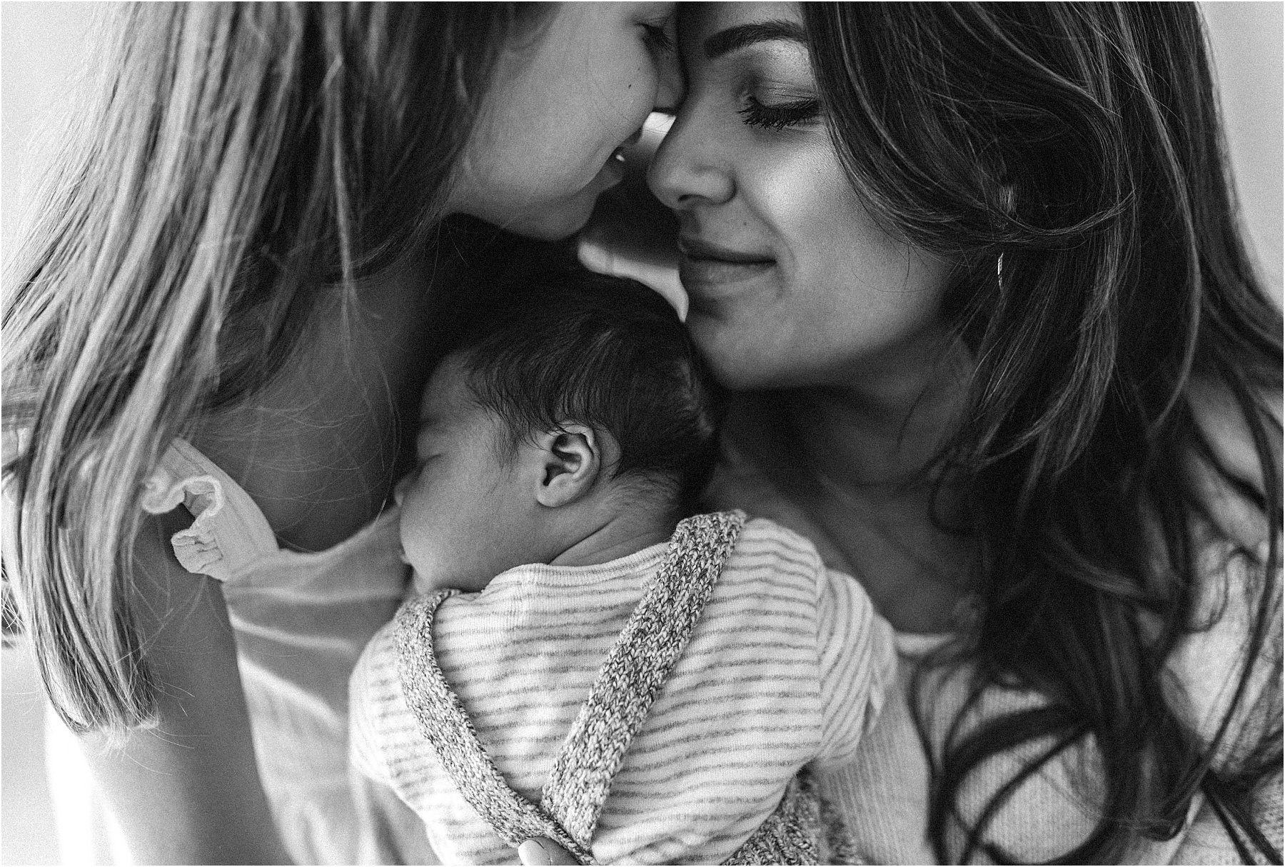 Baby boy and big sister sibling newborn photography black and white studio