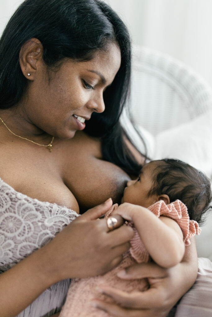 Indian mother breastfeeds her newborn baby