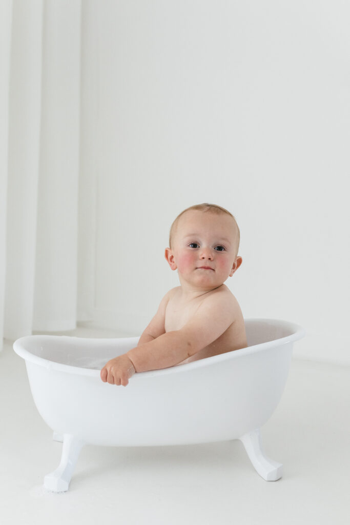 Mini roll top bath with baby splashing photoshoot 