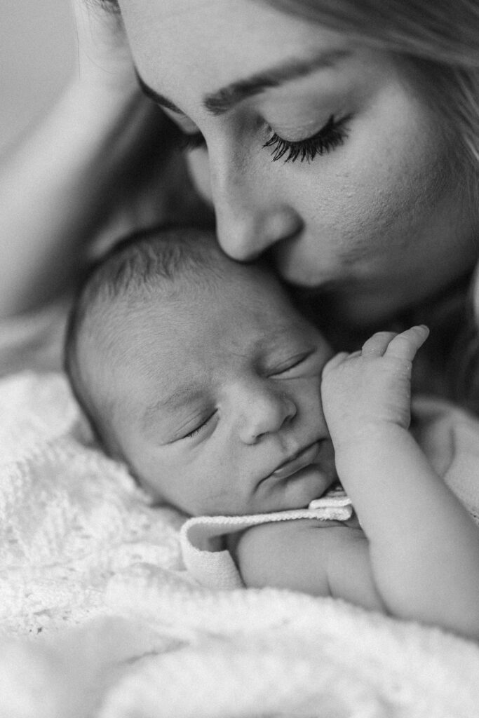 Close up of mother and baby duringg newborn photoshoot