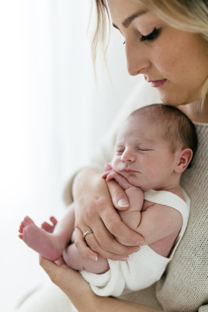 Photograph of mother and baby at newborn photoshoot