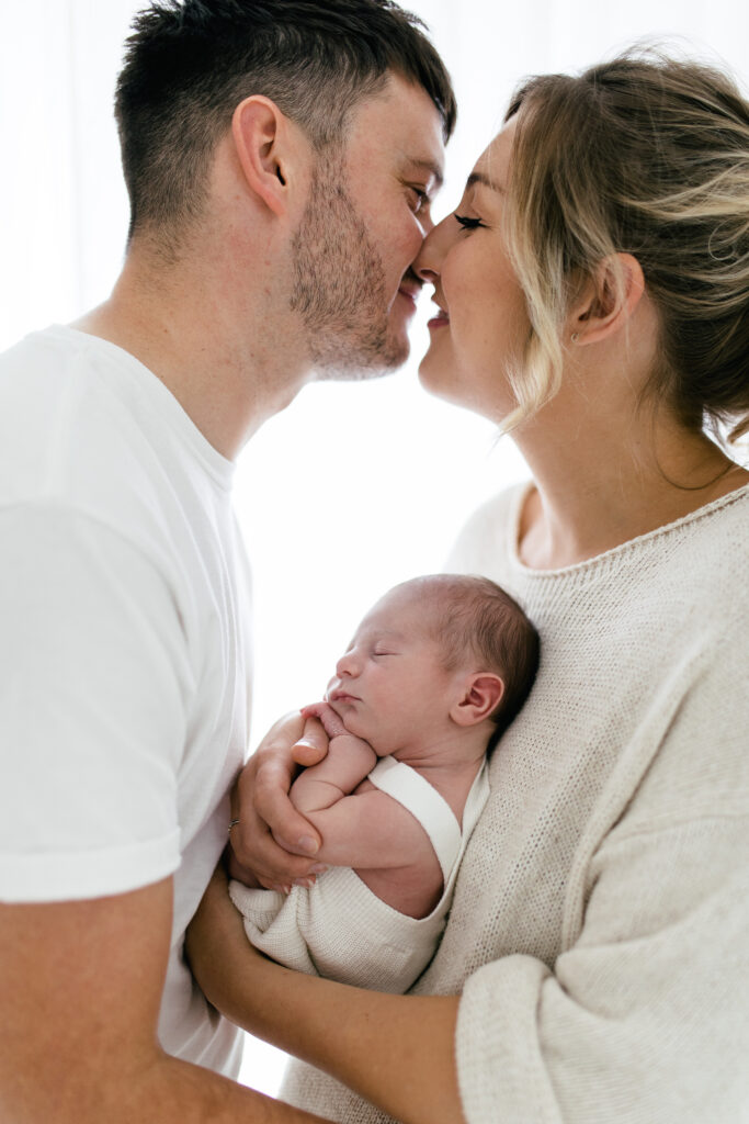 Baby's first year photoshoot with newborn baby and parents 